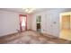 Inviting bedroom with pink ruffle curtains and doors leading to an ensuite bathroom at 3223 Heritage Way, Buford, GA 30519