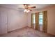 This bedroom provides a relaxing space with natural light from the window and neutral tones at 3223 Heritage Way, Buford, GA 30519