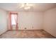 Bright bedroom with pink ruffle curtains and a ceiling fan at 3223 Heritage Way, Buford, GA 30519