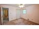 This bedroom features neutral walls, a ceiling fan, and natural light at 3223 Heritage Way, Buford, GA 30519