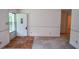 Bright entryway featuring fresh paint, a carpeted floor, and an abundance of natural light at 3223 Heritage Way, Buford, GA 30519