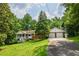 Charming single-Gathering home with a brick facade, inviting front porch, two-car garage, and a lush green lawn at 3223 Heritage Way, Buford, GA 30519