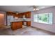 Charming kitchen and dining area with wood cabinets and a bay window at 3223 Heritage Way, Buford, GA 30519