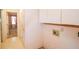 This laundry room offers storage cabinets and laundry hook ups at 3223 Heritage Way, Buford, GA 30519