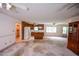 Bright, open living space with wood cabinets and large windows offers ample natural light at 3223 Heritage Way, Buford, GA 30519