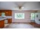 Bright living room with open kitchen, bay window, and outdoor access at 3223 Heritage Way, Buford, GA 30519