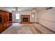 Spacious living room with a fireplace feature and built-in shelves at 3223 Heritage Way, Buford, GA 30519
