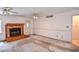 Cozy living room with tiled fireplace and access to backyard at 3223 Heritage Way, Buford, GA 30519