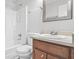 Bathroom features tub with shower, toilet, and vanity with mirror at 998 Pointer Rdg, Tucker, GA 30084
