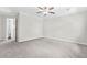 Spacious bedroom with neutral carpet, ceiling fan, and ensuite bathroom at 998 Pointer Rdg, Tucker, GA 30084
