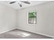 Well-lit bedroom with plush carpet, ceiling fan and double-hung windows at 998 Pointer Rdg, Tucker, GA 30084