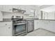 Updated kitchen features stainless steel oven, range and dishwasher at 998 Pointer Rdg, Tucker, GA 30084