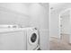 Laundry room equipped with a modern washer and dryer at 998 Pointer Rdg, Tucker, GA 30084