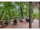 Large wooden back deck with a grill and seating offers stunning views at 1515 Lockridge Dr, Cumming, GA 30041