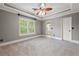 Bedroom featuring neutral paint colors, carpet floors and natural light at 1515 Lockridge Dr, Cumming, GA 30041