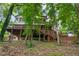 Rear exterior view of the house showing the multi-level deck and wooded surroundings at 1515 Lockridge Dr, Cumming, GA 30041