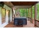Covered hot tub on deck offers privacy and relaxation at 1515 Lockridge Dr, Cumming, GA 30041