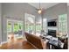 Bright living room featuring hardwood floors, high ceilings, a fireplace and lots of natural light at 1515 Lockridge Dr, Cumming, GA 30041