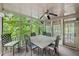 Covered porch with ceiling fan, seating and screened windows at 1515 Lockridge Dr, Cumming, GA 30041