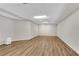 Finished basement space with neutral walls, and wood-look flooring at 1548 Valley Reserve Court, Kennesaw, GA 30152