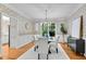 Elegant dining room with hardwood floors, and floral wallpaper at 1548 Valley Reserve Court, Kennesaw, GA 30152