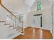 Bright foyer with hardwood floors, and a staircase with white railings at 1548 Valley Reserve Court, Kennesaw, GA 30152
