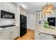 This kitchen features granite countertops, custom cabinets, and stainless steel appliances at 1548 Valley Reserve Court, Kennesaw, GA 30152