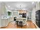 Bright kitchen offers granite countertops, custom cabinets, a center island and stainless appliances at 1548 Valley Reserve Court, Kennesaw, GA 30152