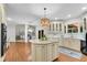 Spacious kitchen featuring a center island, pendant lighting, and a view of an adjacent breakfast room at 1548 Valley Reserve Court, Kennesaw, GA 30152