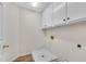 A dedicated laundry room is equipped with storage cabinets, and space for a washer and dryer at 1548 Valley Reserve Court, Kennesaw, GA 30152