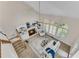 Bright living room with fireplace, custom shelving, vaulted ceilings and large windows at 1548 Valley Reserve Court, Kennesaw, GA 30152