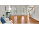 Living room with hardwood floors, natural light, and view to foyer at 1548 Valley Reserve Court, Kennesaw, GA 30152