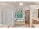 Ensuite bathroom with garden tub, walk-in shower, and separate vanities at 1548 Valley Reserve Court, Kennesaw, GA 30152