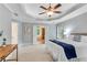 Spacious main bedroom with tray ceilings leading to the ensuite bathroom at 1548 Valley Reserve Court, Kennesaw, GA 30152