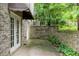 Brick patio area with partial brick wall, offering a private outdoor space at 1548 Valley Reserve Court, Kennesaw, GA 30152