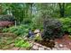 Picturesque waterfall feature in the lush backyard garden at 1548 Valley Reserve Court, Kennesaw, GA 30152