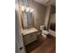 Bright bathroom with granite countertop vanity and shower in the background at 170 Inverness Trce, Riverdale, GA 30274