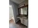 Bright bathroom featuring updated vanity with granite counters and white cabinets at 170 Inverness Trce, Riverdale, GA 30274