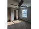 Bedroom with neutral carpet, a ceiling fan, and a window at 170 Inverness Trce, Riverdale, GA 30274