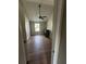 Bedroom view features neutral wall color, wood-look laminate flooring, and a ceiling fan at 170 Inverness Trce, Riverdale, GA 30274