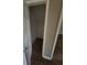 A small storage closet with neutral paint and flooring at 170 Inverness Trce, Riverdale, GA 30274