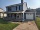 Charming two-story home with a cozy front porch and attached one-car garage at 170 Inverness Trce, Riverdale, GA 30274