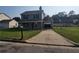 Traditional two-story home with driveway, porch, fenced yard and nice landscaping at 170 Inverness Trce, Riverdale, GA 30274