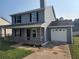 Charming two-story home with a cozy front porch and attached one-car garage at 170 Inverness Trce, Riverdale, GA 30274