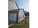 Shot of garage exterior with vinyl siding and an overhead door at 170 Inverness Trce, Riverdale, GA 30274
