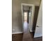 Hallway with modern flooring connecting to various rooms at 170 Inverness Trce, Riverdale, GA 30274
