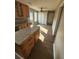 Kitchen with granite countertops, wood cabinets, stainless appliances, and wood flooring at 170 Inverness Trce, Riverdale, GA 30274