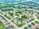 Aerial view of a residential neighborhood with well-maintained lawns, mature trees, and neatly arranged homes at 3145 Sweet Basil Ln, Loganville, GA 30052