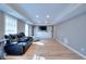 Finished basement features recessed lighting, vinyl flooring, and built-in shelving for storage and entertainment at 3145 Sweet Basil Ln, Loganville, GA 30052