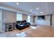 Finished basement with vinyl floors, built-in shelving and cabinets, and a comfortable seating area at 3145 Sweet Basil Ln, Loganville, GA 30052